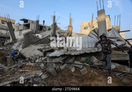 Rafah, Gaza. 17th Dec, 2023. A palestinian boy walk on debris of destroyed house after Israeli airstrike in Rafah, Gaza on December 17, 2023. amid the ongoing battles between Israel and the Palestinian group Hamas. Internet access and the phone network were completely cut across the Gaza Strip. Photo by Ismael Mohamad/UPI Credit: UPI/Alamy Live News Stock Photo