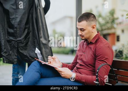 Cityscape with a Diverse Group of Young Professionals Collaborating on Business Strategies and Analyzing Statistics for Successful Profit Growth Stock Photo