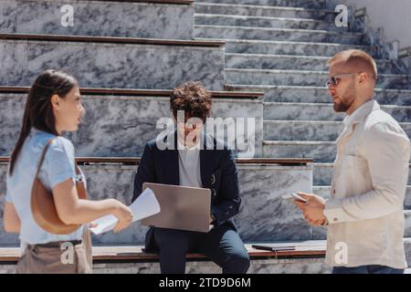 Business people in the city for planning, discussing strategy. Teamwork, people discussing, planning, sharing ideas Stock Photo