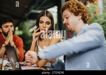 Successful Collaboration of Architects and Engineers Discussing Detailed Blueprint for a New Urban Construction Project Stock Photo