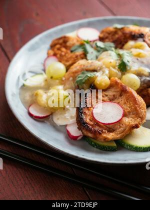 Asian Barbecued TVP Medallion Salad with Gooseberry Sauce Stock Photo