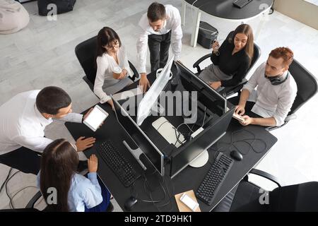 Team of young programmers working in office, top view Stock Photo