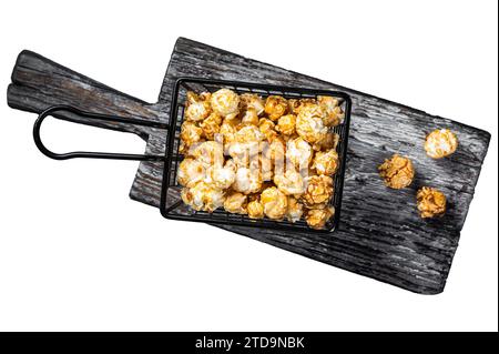 Popcorn with caramel in basket. Isolated on white background Stock Photo