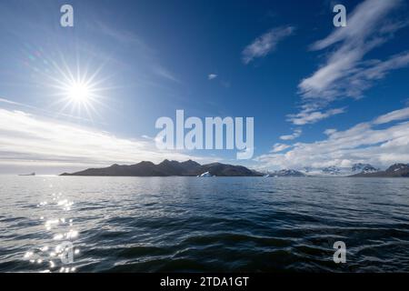 South Georgia, Grytviken. Wide angle view of the coastline at Grytviken with sunburst. Stock Photo