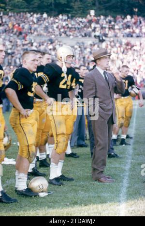 WEST POINT, NY - OCTOBER 4: Harry Walters #33, Pete Dawkins #24 and head coach Earl 'Red' Blaik of the Army Cadets stand on the sidelines during an NCAA game against the Penn State Nittany Lions on October 4, 1958 at Michie Stadium in West Point, New York. The Cadets defeated the Nittany Lions 26-0. (Photo by Hy Peskin) *** Local Caption *** Harry Walters;Pete Dawkins;Earl 'Red' Blaik Stock Photo