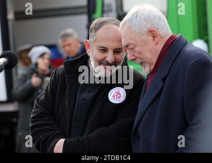 Krakow, Poland - Dec 17, 2023: Priest Tadeusz Isakowicz-Zaleski and Jacek Majchrowski at the Main Square during the Christmas Eve for poor and homeless Stock Photo