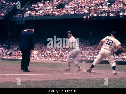 DETROIT, MI - JULY 5: Third baseman Granny Hamner #7 of the Cleveland Indians misses the tag as Bobo Osborne #32 of the Detroit Tigers reaches third base as umpire Bill Summers is there to make the call during an MLB game on July 5, 1959 at Briggs Stadium in Detroit, Michigan. (Photo by Hy Peskin) *** Local Caption *** Granny Hamner;Bobo Osborne;Bill Summers Stock Photo