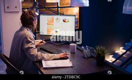 Furious stressed employee working on business project overtime, trying to finish financial report with analytics before deadline. Entrepreneur feeling frustrated under pressure. Handheld shot. Stock Photo