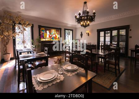 Dining Room With Wooden Tables and Chairs Stock Photo