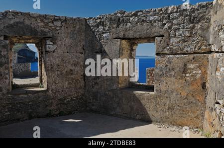 136+ Windows in the remains of a a garrison building, Ali Pasha of Tepelene castle upper terrace, Porto Palermo bay. Himare-Albania. Stock Photo