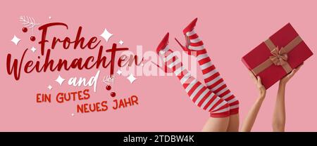 Text FROHE WEIHNACHTEN END GUTES NEUES JAHR (German for Merry Christmas and Happy New Year) and woman in Christmas stockings and with gift on pink bac Stock Photo
