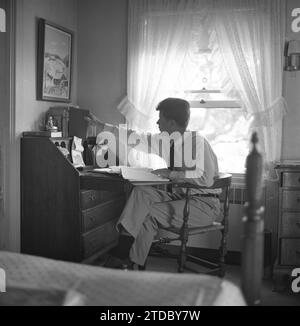 HYANNIS PORT, MA  - JUNE 1953:  Senator John F. Kennedy on vacation at the Kennedy compound in June 1953 in Hyannis Port, Massachusetts. (Photo by Hy Peskin) Stock Photo