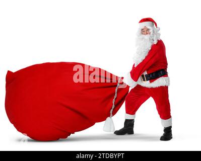 Santa Claus with big red bag full of Christmas presents on white background Stock Photo