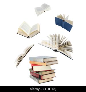Books flying over stack on white background Stock Photo
