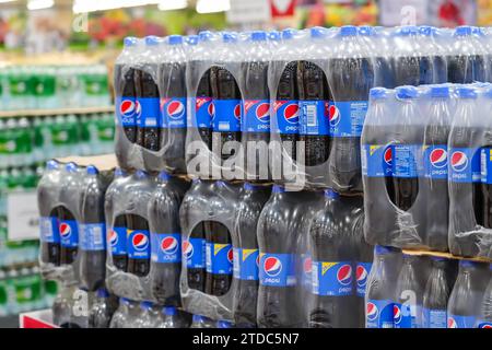 Packaging of plastic Pepsi Co bottles in film on pallets for sale in retail and wholesale stores. Thailand, Bangkok 13 december 2023. Stock Photo