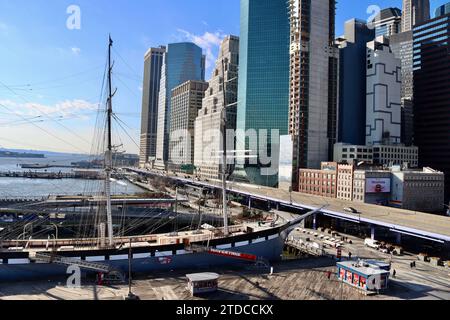 The old museum ships at South Street Seaport with FDR drive and the Financial District in the background at lower Manhattan, New York Stock Photo