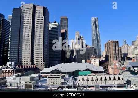 The roofs of Tin building and Fulton market building with Frank Gehry's tower and Southbridge towers in lower Manhattan, New York Stock Photo