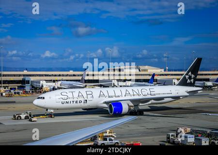 San Mateo County, United States - November 6 2023: United Airlines Star Alliance Boeing 777 200ER Blue Engines San Francisco International Airport SFO Stock Photo