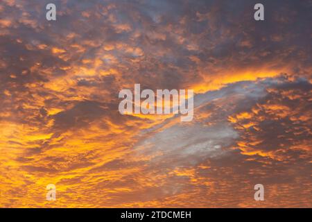 Brilliant orange and yellow cloudscape sky replacement or wallpaper. Stock Photo
