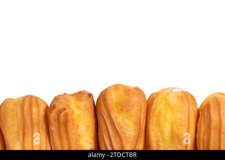Sweet eclairs isolated on a white background. Top view. Stock Photo