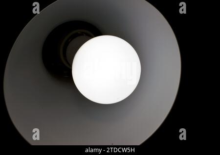 Led lamp light, an electric light that produces light using light-emitting diodes (LEDs). LED lamps are significantly more energy-efficient than equiv Stock Photo