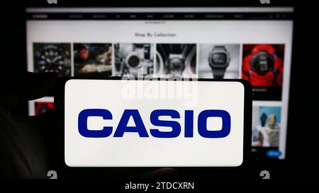 Casio company logo on a website with blurry stock market