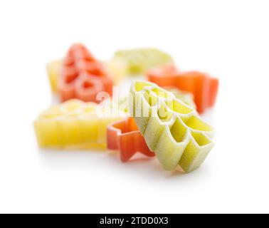 Uncooked raw pasta. Various Christmas shapes. Pasta isolated on the white background. Stock Photo