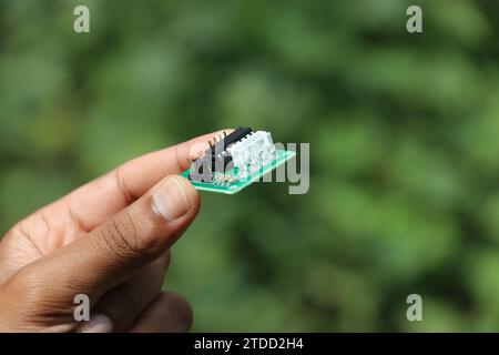 Stepper motor driver used to run stepper motors held in the hand Stock Photo