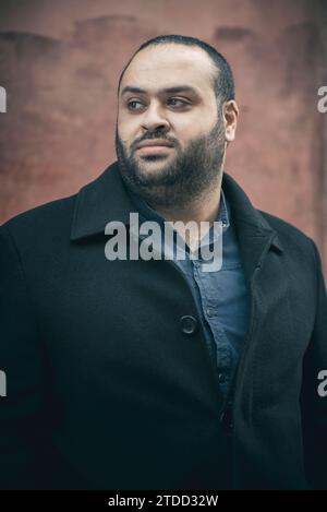 Chubby man looking away outdoors Stock Photo - Alamy