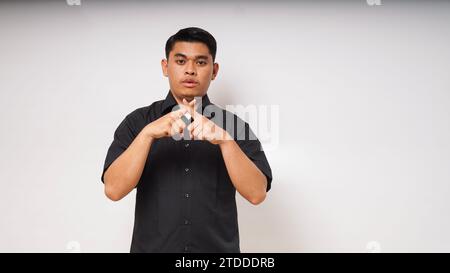 asian man is using sign language with hand. learn sign language by hand. ASL American Sign Language Stock Photo