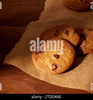 Tates cookies on wood with parchment paper Stock Photo