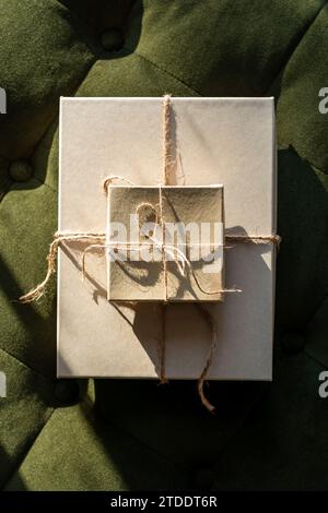 Two small gift boxes tied with string for christmas Stock Photo