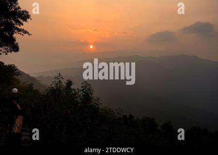 Silhouette of Dramatic sky during sunset in the mountain Stock Photo