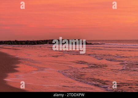 Sunrise over the waves of the Atlantic Ocean Stock Photo