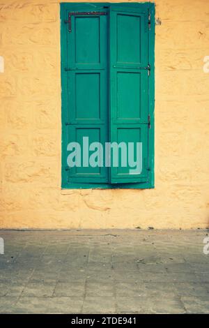 Old fashioned green shutters Stock Photo