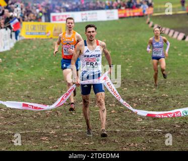 Alexis Miellet of France crosses the finishing line to help his team win gold in the mixed relay race at the SPAR European Cross Country Championships Stock Photo