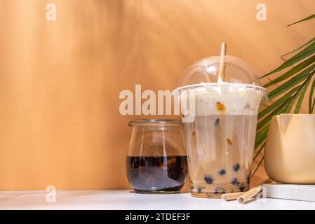 Tapioca boba balls coffee frappe, asian trendy cold coffee drink with tapioca balls and whipped coconut cream and caramel sauce Stock Photo