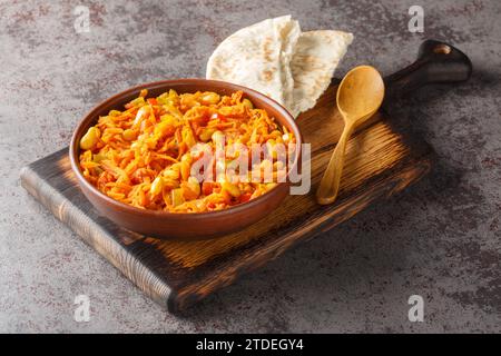 Chakalaka Spicy Vegetable Relish with carrot, baked bean, onion, tomato, pepper closeup on the bowl on the table. Horizontal Stock Photo