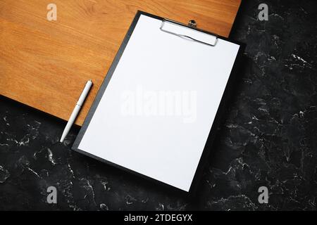 Clipboard with blank letterhead and pen. Blank stationery template with plenty of copy space. Stock Photo