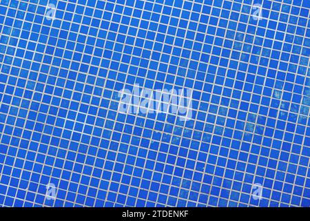 Small blue ceramic tiles in outdoor fountain pool as background and pattern Stock Photo