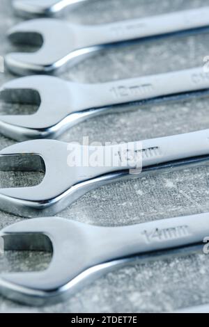 Set of wrenches gray concrete background Stock Photo