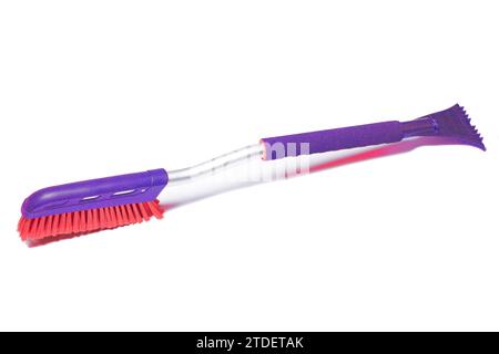Car brush with a scraper for cleaning the car in winter about snow and ice, isolated on white Stock Photo
