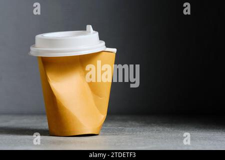 Crumpled paper cup for hot coffee and tea drinks Stock Photo