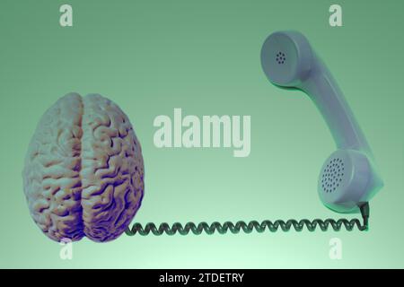 Telephone receiver with human brain anatomical model isolated on white background. Stock Photo