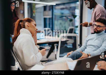 Colleagues collaborating on business expansion and strategizing for profit growth Stock Photo