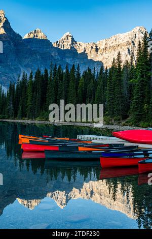 Canoes at sunrise at Lake Moraine, Banff National Park, UNESCO World Heritage Site, Alberta, Rocky Mountains, Canada, North America Stock Photo