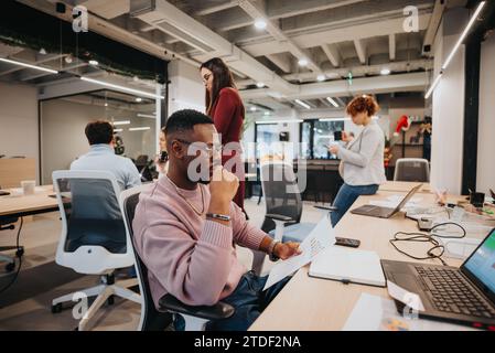 Business professionals collaborate on budgeting, financial growth, and market analysis in a modern office environment. Stock Photo