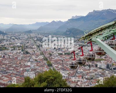 View from the Bastille hill over Grenoble with mountains in the background and cable car in the foreground, Grenoble, Auvergne-Rhone-Alpes, France Stock Photo