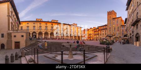 Arezzo Tuscany Italy. A group of people walking down a street