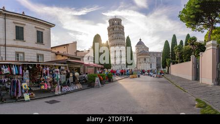 View of souvenir stalls and Leaning Tower of Pisa at sunset, UNESCO World Heritage Site, Pisa, Province of Pisa, Tuscany, Italy, Europe Stock Photo